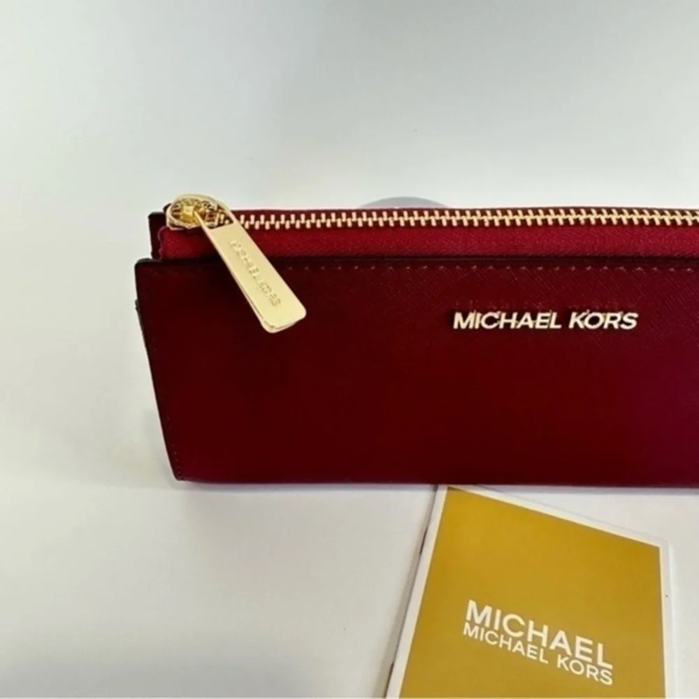 Michael Kors Large three Quarter zip Leather wallet in Mulberry